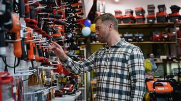 A Man Buying a Drill in a Hardware Store video