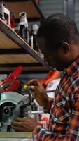 African-American Man Selecting a Circular Saw in a Tool Store video