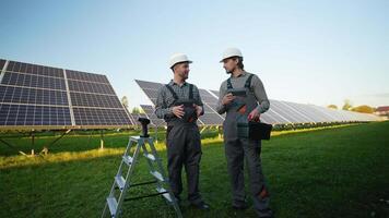 Workers Discuss Installation Near Solar Panels video