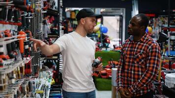 Sales Assistant Helping Customer Choose a Cordless Screwdriver video