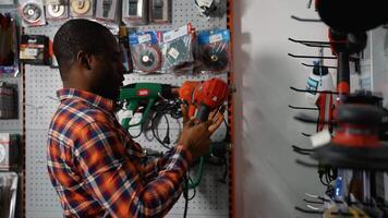Man Choosing a Drill in a Hardware Store video