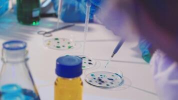 A person in a lab coat is working on a project video