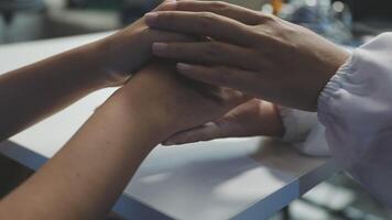 A person holding hands with another person video