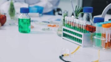 A laboratory table with various test tubes and bottles video