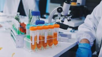 A lab technician is working in a lab video