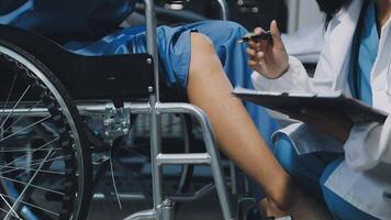 A doctor is examining a patient in a wheelchair video