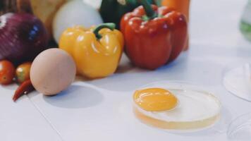 A white table with a variety of vegetables and eggs video