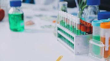 A laboratory table with several test tubes and other items video