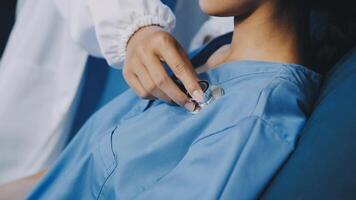 A nurse is putting a pacemaker on a patient video