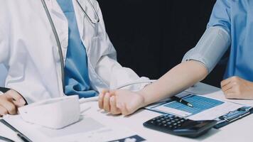 A doctor checking the blood pressure of a patient video