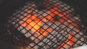 A close up of a grill with fire inside video