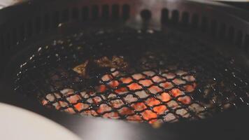 A grill with meat and vegetables cooking on it video