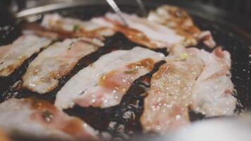 A close up of a grill with meat on it video