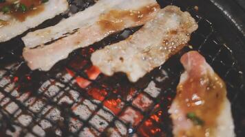 Bacon on a grill with sauce video