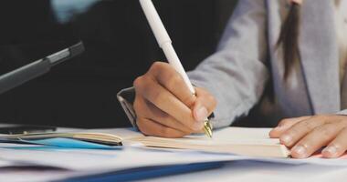 A person is writing on a piece of paper with a pen video
