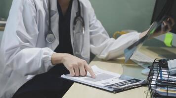 A doctor is working on a computer video