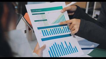 A person is looking at a chart on a paper video