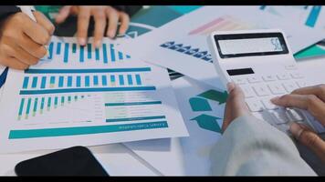 A person is using a calculator to make a financial report video