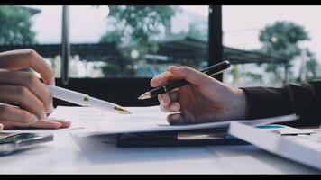 A person is writing on a piece of paper with a pen video