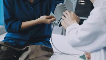 A doctor checking the blood pressure of a patient video