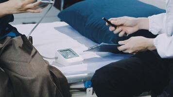 A doctor is checking the pulse of a patient video