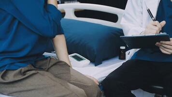 A doctor is talking to a patient in a hospital bed video
