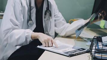 A doctor is working on a computer video