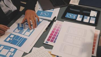 A person is working on a laptop with a design on it video