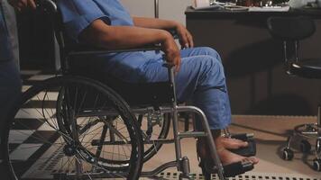 A woman in a wheelchair is sitting in a room video