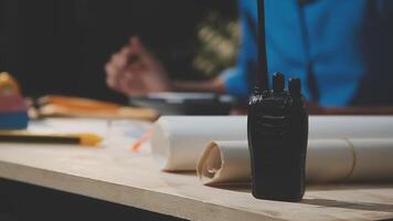 A man is working on a project with a radio video