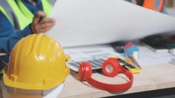 Two construction workers are working on a project video
