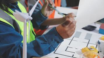 A man in a safety vest is working on a project video