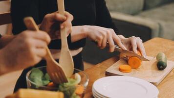 A person cutting vegetables with a knife and fork video
