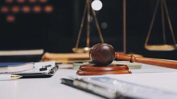 Law and justice concept with gavel and scales of justice on desk video