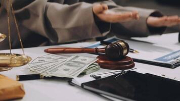 A judge's gavel and money on a desk video