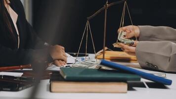 Two business people are holding money and a scale video