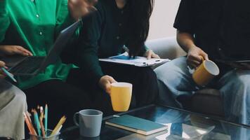 Group of people sitting on a couch with laptops video