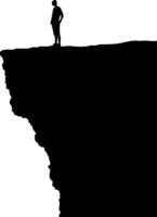 Silhouette of Person Standing on Cliff Edge Contemplating Risk and Adventure vector