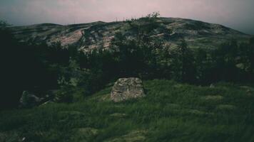 Mysterious landscape with rugged hills and rocky formations at dusk video