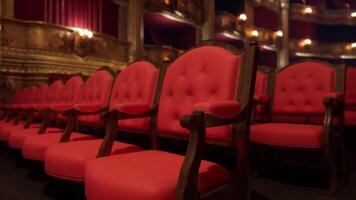 Empty red velvet seats in an old opera house during a quiet afternoon video