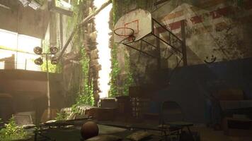 An old basketball rests on a worn surface in a deserted gym video