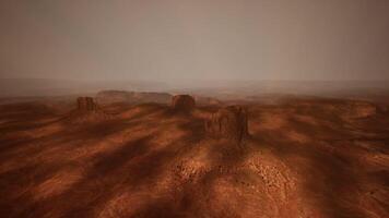 Desolate landscape of monument valley during a hazy afternoon video