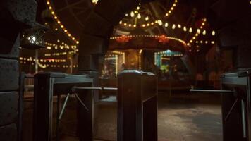 Empty amusement park at night with illuminated rides and quiet atmosphere video
