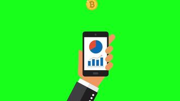 The hand of a successful investor holds a phone on the screen of which there is a stock chart of currency growth. Bitcoin coins replenish your wallet on your phone. Green screen. video
