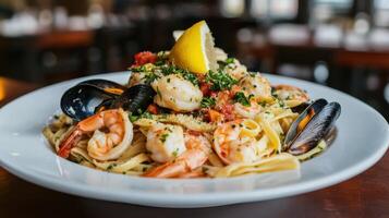 Seafood pasta with shrimps, mussels and tomatoes photo