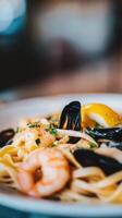 Seafood pasta with shrimps and mussels - Italian food style photo
