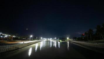 Night view of the river in the city with the reflection of the star photo