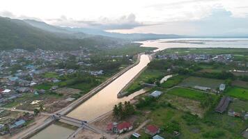 Aerial view of the city with Canal and mountain at sunset. photo
