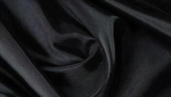 A black satin fabric with a dark color photo