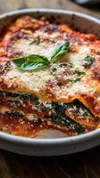 Spinach lasagna with ricotta and mozzarella cheese photo